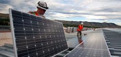 People installing solar panels